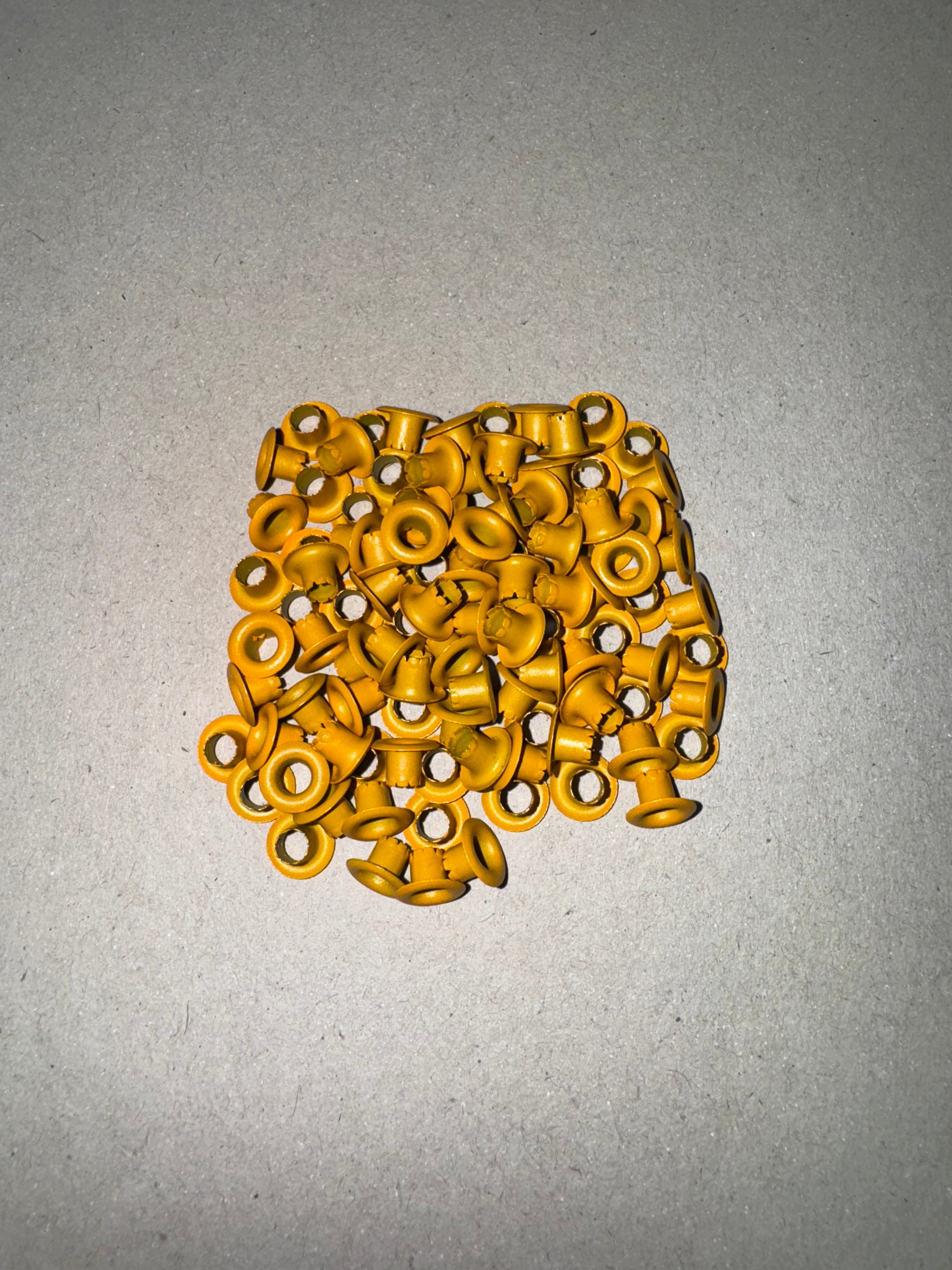 Ojetillo Metálico Amarillo Mostaza 4MM 14 grs